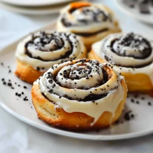 Close-up of cinnamon rolls filled with crushed Oreos and topped with icing