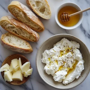 Creamy whipped feta cheese drizzled with hot honey on a plate